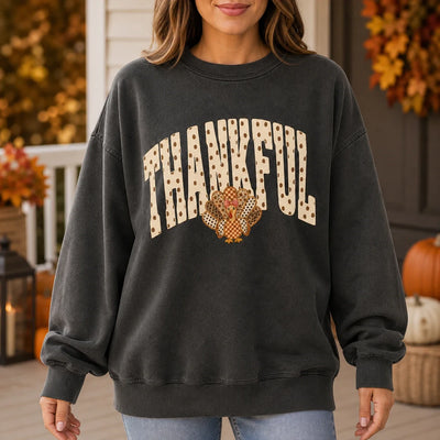 Thankful turkey sweatshirt with arched THANKFUL lettering above a cute patchwork turkey graphic